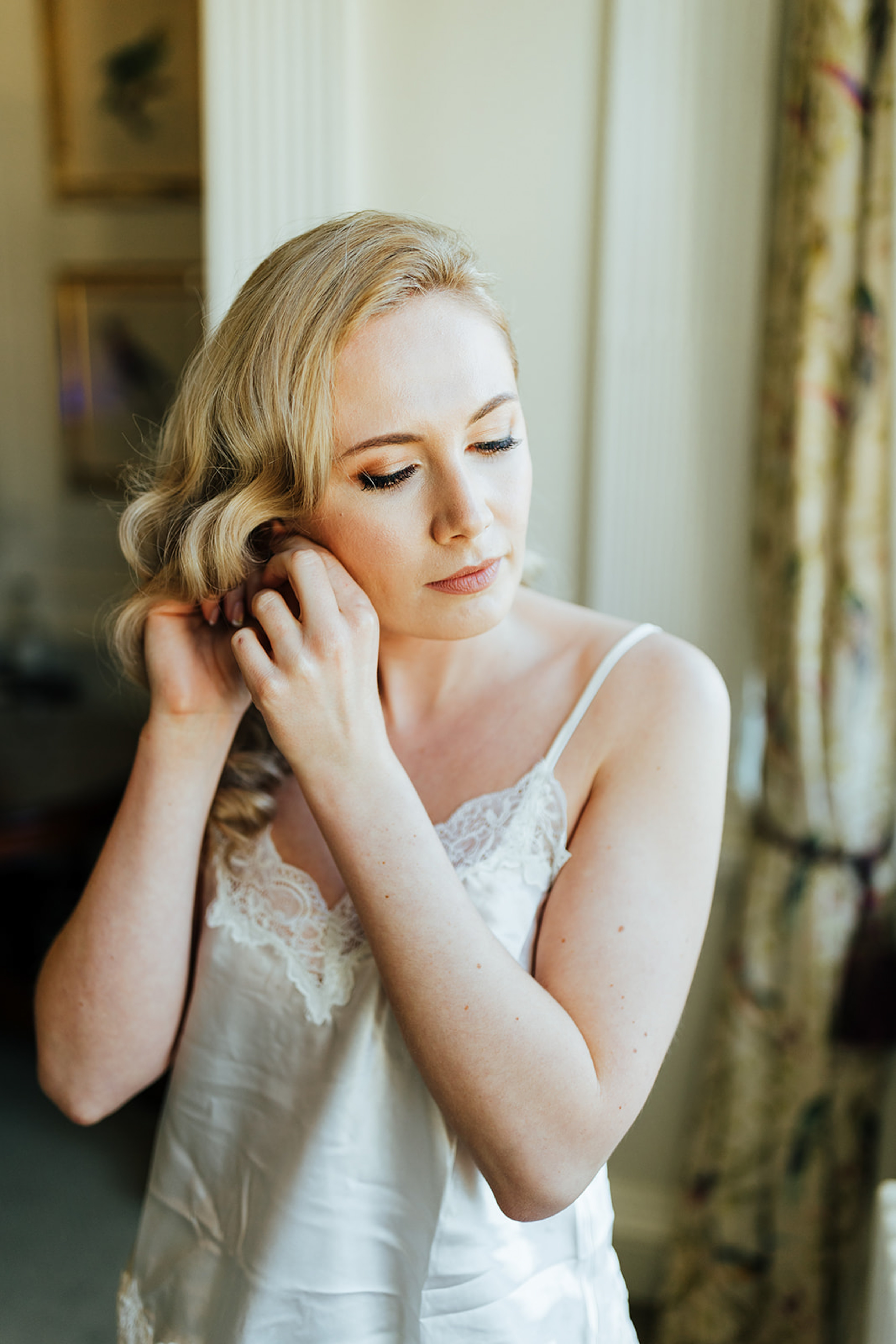 Bride Portrait during wedding morning preparations at Rushton Hall. UK Wedding Photographer. Aimee Joy Photography.